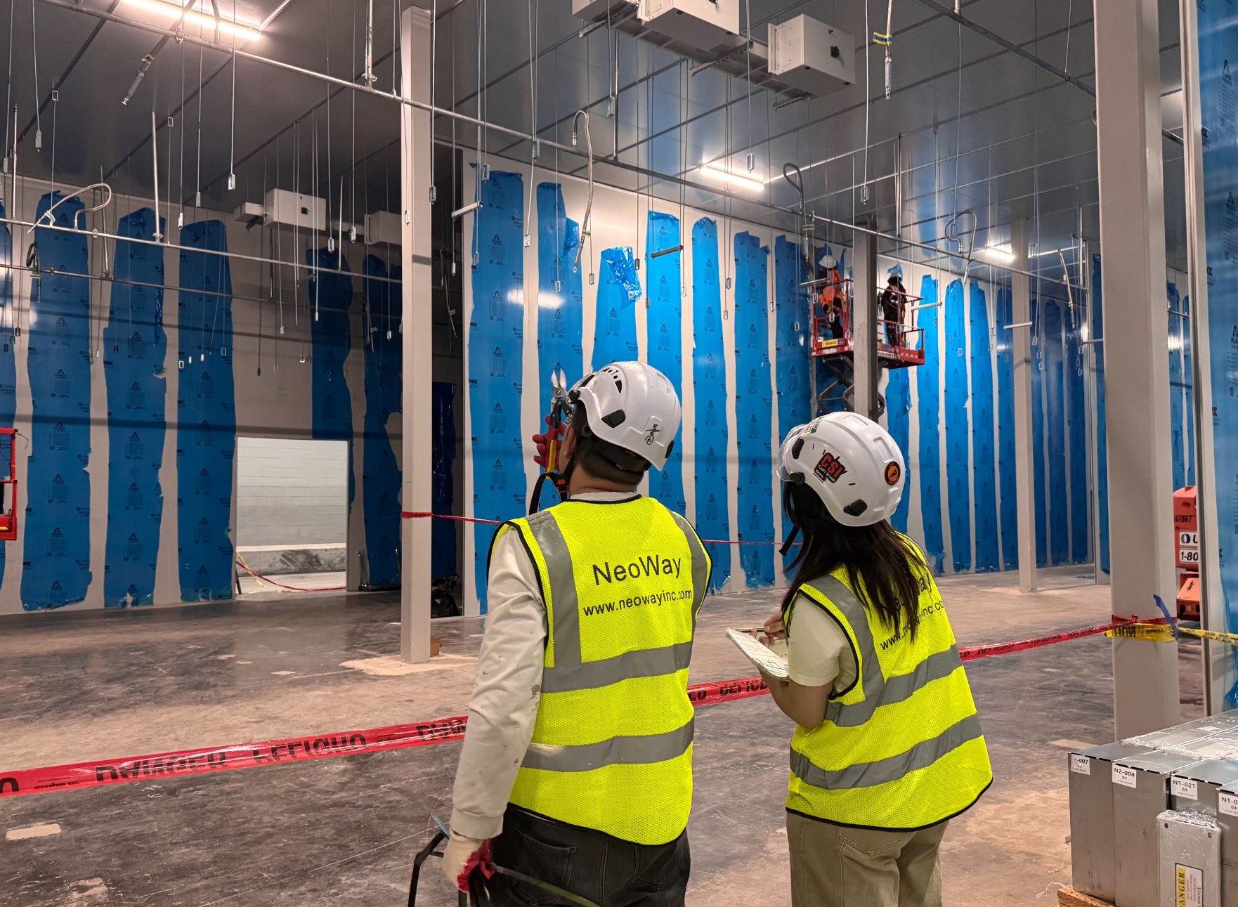 NeoWay team inspecting a specialized room build-out
