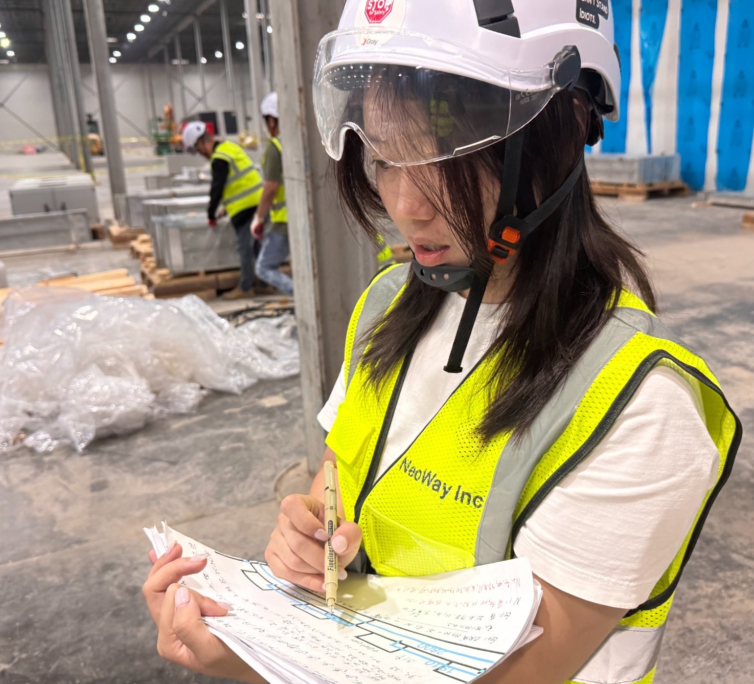 Engineer reviewing field notes on site